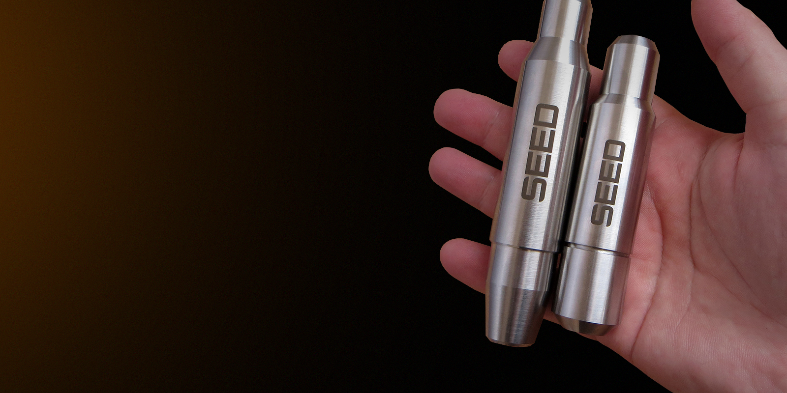 SEED and SEED2 tattoo machines in hand